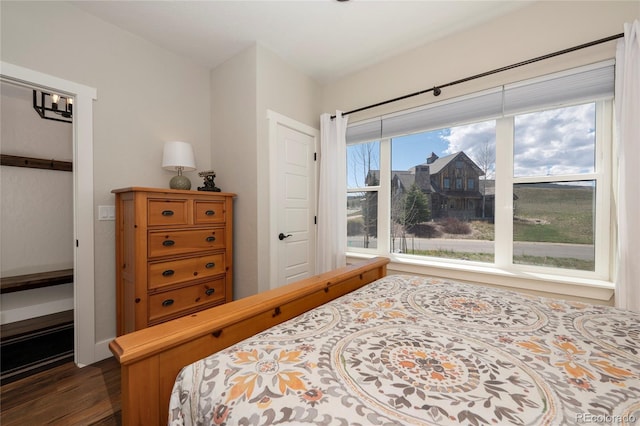 719 Saddle Ridge Cir, Granby, CO 80446 - bedroom with dark wood-style flooring