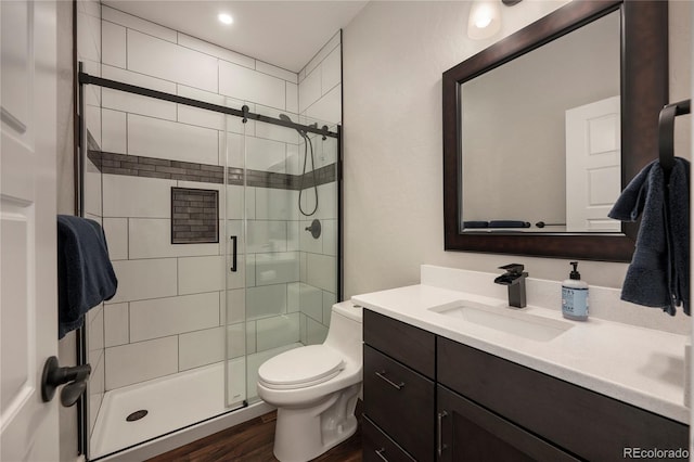 719 Saddle Ridge Cir, Granby, CO 80446 - bathroom featuring vanity, a stall shower, toilet, and wood finished floors