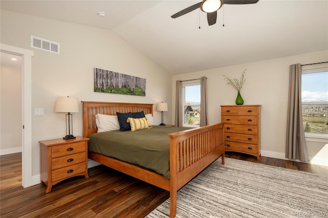 719 Saddle Ridge Cir, Granby, CO 80446 - bedroom with wood finished floors, vaulted ceiling, multiple windows, baseboards, and ceiling fan