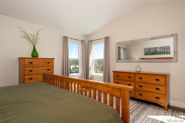 719 Saddle Ridge Cir, Granby, CO 80446 - bedroom with vaulted ceiling and baseboards