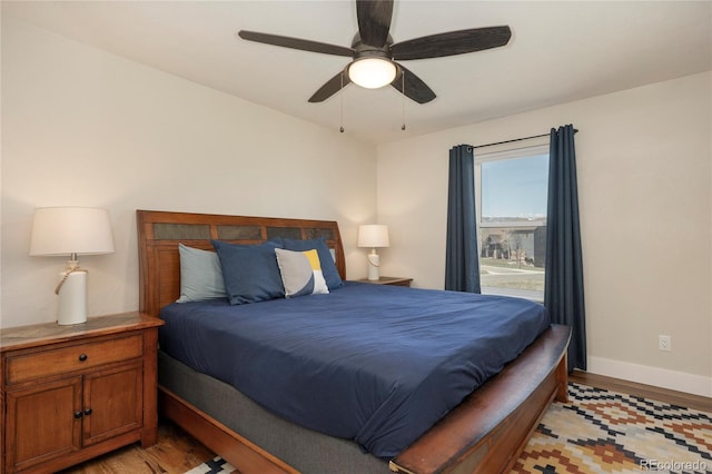 719 Saddle Ridge Cir, Granby, CO 80446 - bedroom with light wood-style flooring, baseboards, and ceiling fan