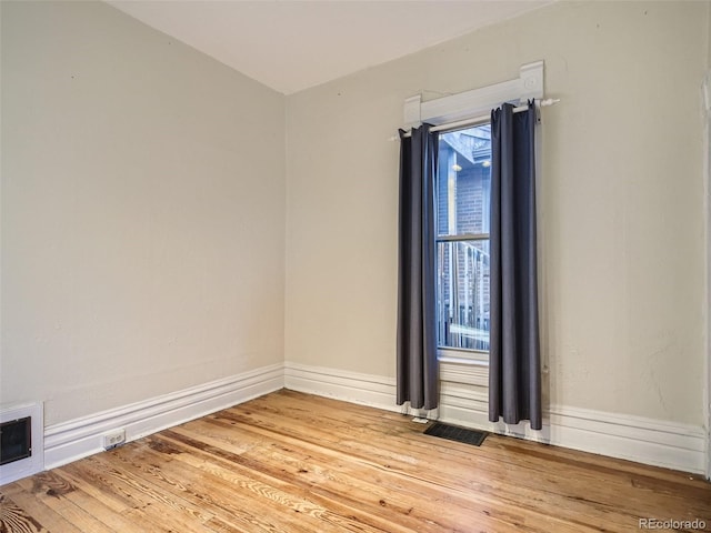 empty room with light hardwood / wood-style floors