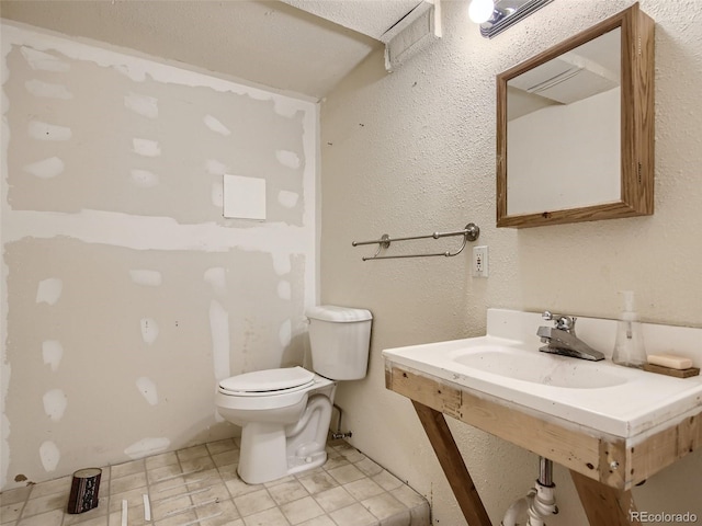 bathroom with toilet and sink