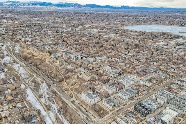 birds eye view of property with a water and mountain view