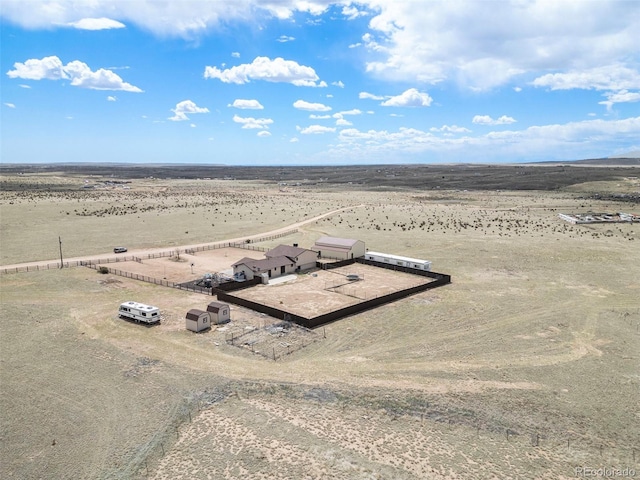 bird's eye view with a desert view and a rural view