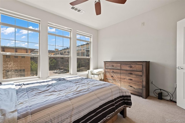 bedroom featuring ceiling fan and light colored carpet