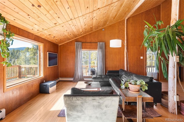 living room featuring wood ceiling, vaulted ceiling, light hardwood / wood-style flooring, wooden walls, and a baseboard heating unit