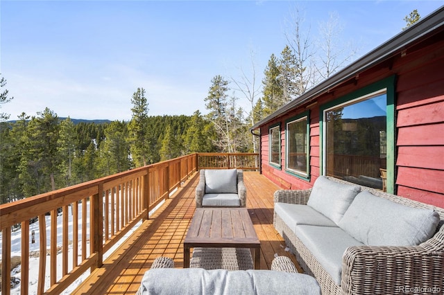 wooden deck with outdoor lounge area