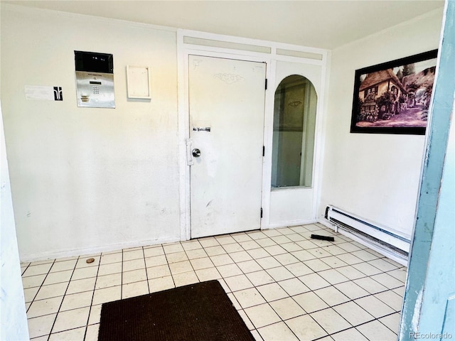 8826 E Florida Ave Unit 102, Denver, CO 80247 - foyer featuring light tile patterned floors, baseboard heating, and arched walkways