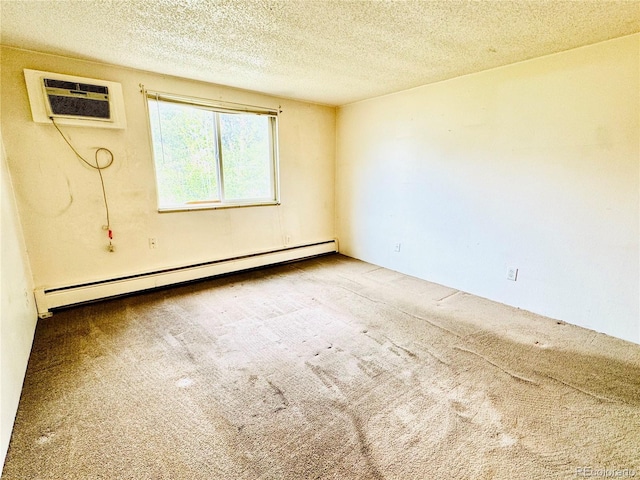 8826 E Florida Ave Unit 102, Denver, CO 80247 - carpeted empty room with a textured ceiling, a wall unit AC, and a baseboard heating unit