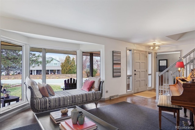 living room with light wood-type flooring and a healthy amount of sunlight