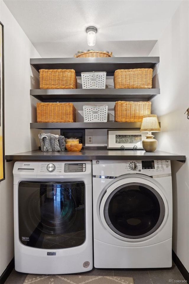 laundry room featuring washing machine and clothes dryer