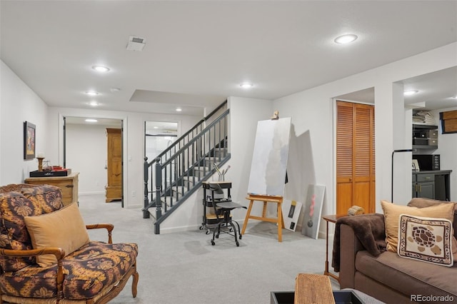 living room with light colored carpet