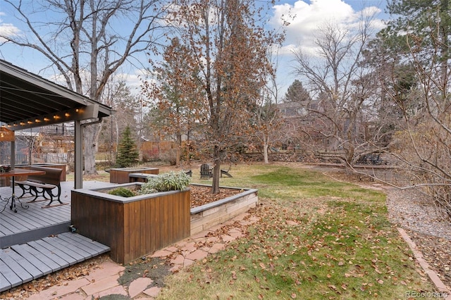 view of yard featuring a wooden deck