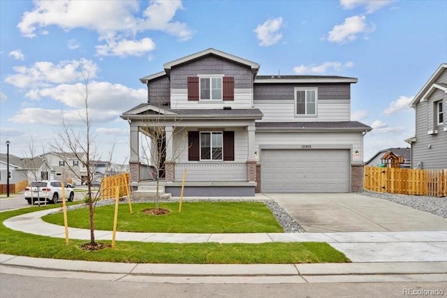 12353 E 101st Pl, Commerce City, CO 80022 - traditional home featuring covered porch, fence, an attached garage, brick siding, and driveway