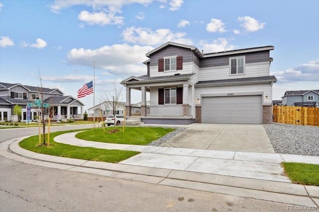 12353 E 101st Pl, Commerce City, CO 80022 - traditional-style house with driveway, brick siding, fence, a garage, and a porch