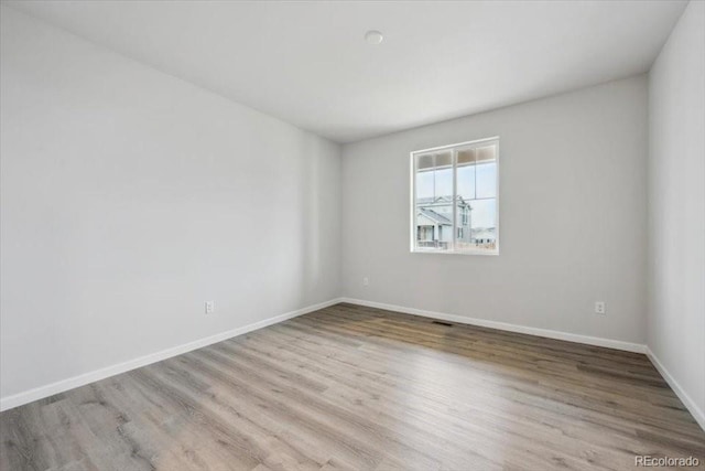 12353 E 101st Pl, Commerce City, CO 80022 - empty room with baseboards and wood finished floors