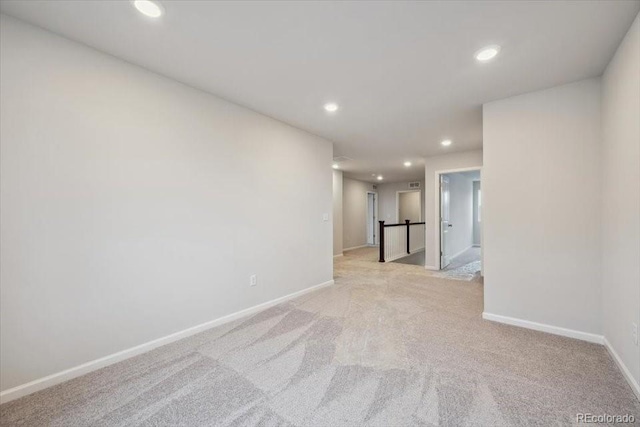 12353 E 101st Pl, Commerce City, CO 80022 - unfurnished room featuring baseboards, light carpet, and recessed lighting