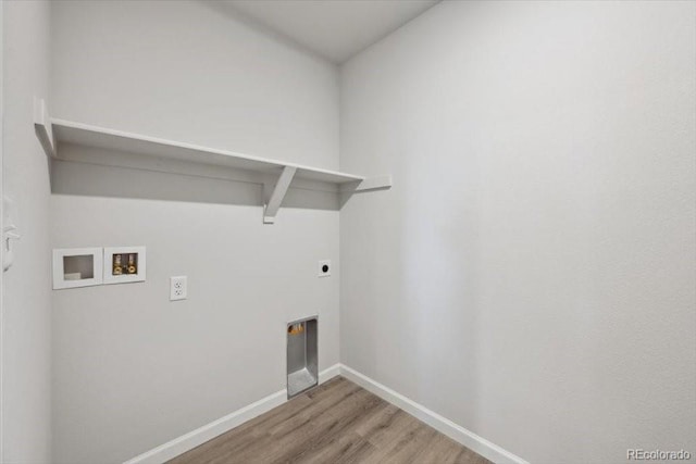 12353 E 101st Pl, Commerce City, CO 80022 - washroom featuring baseboards, washer hookup, wood finished floors, laundry area, and electric dryer hookup