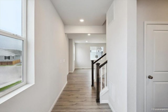 12353 E 101st Pl, Commerce City, CO 80022 - hall with recessed lighting, baseboards, visible vents, and wood finished floors