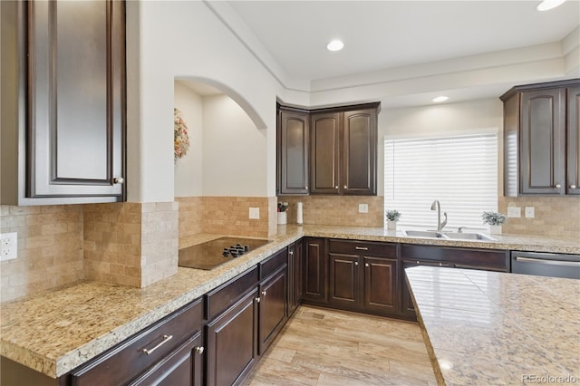 1673 Morningview Ln, Castle Rock, CO 80109 - kitchen featuring a sink, black electric cooktop, dark brown cabinets, recessed lighting, and decorative backsplash