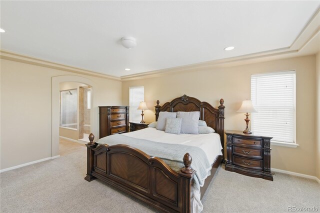1673 Morningview Ln, Castle Rock, CO 80109 - bedroom featuring arched walkways, light colored carpet, baseboards, recessed lighting, and connected bathroom