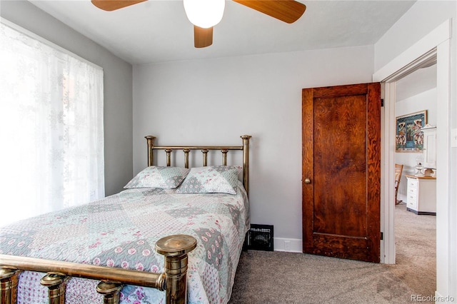 bedroom with light carpet and ceiling fan