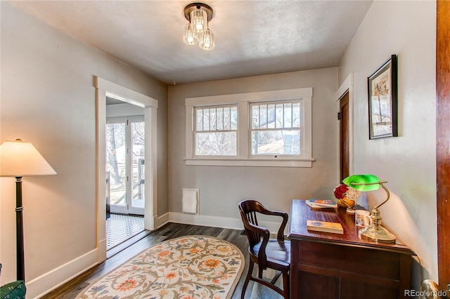 office featuring baseboards and dark wood-style flooring