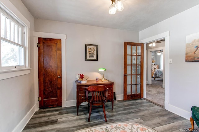 interior space with baseboards, dark wood finished floors, and french doors