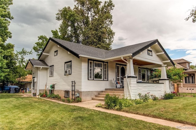 view of front of house with central AC unit, a porch, and a front yard