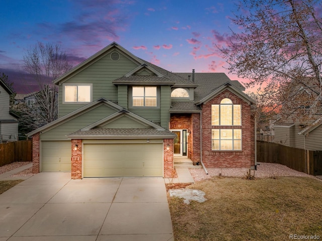 view of front of home featuring a shingled roof, fence, driveway, and an attached garage