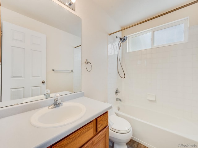 bathroom featuring toilet, tub / shower combination, and vanity