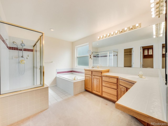 full bath featuring a garden tub, tile patterned flooring, a shower stall, and vanity