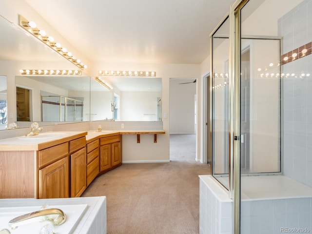 bathroom with a bath, tasteful backsplash, double vanity, and a sink