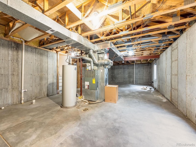 unfinished basement featuring heating unit and gas water heater