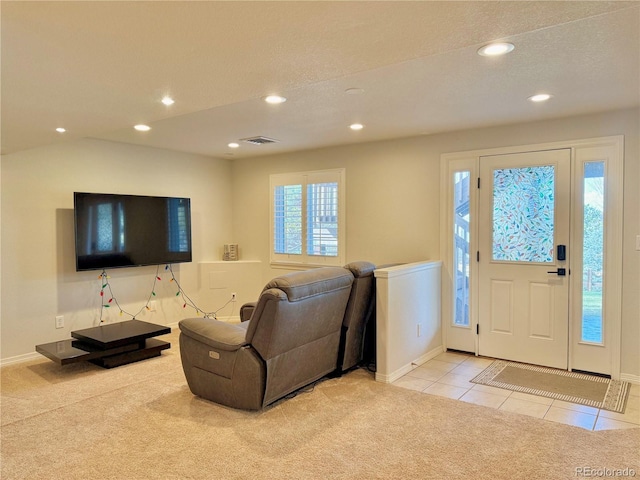 entryway featuring recessed lighting, baseboards, visible vents, and light colored carpet