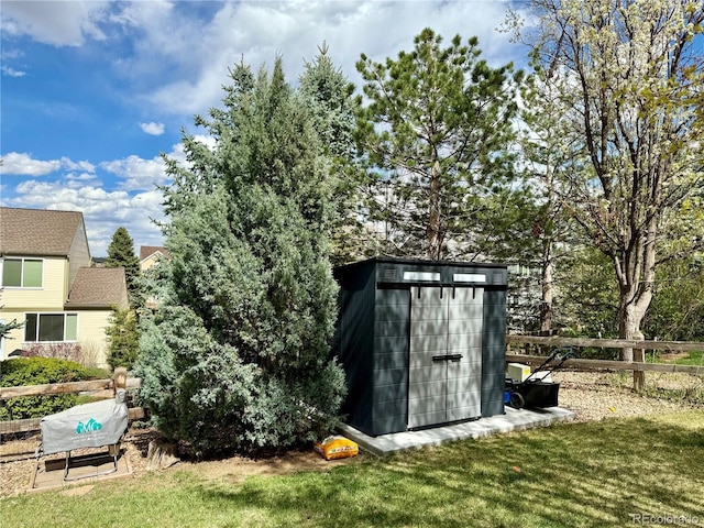 view of shed with fence