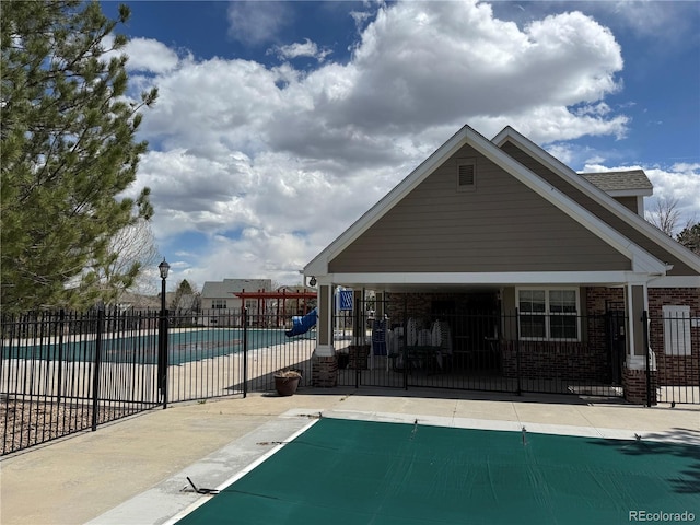 pool featuring fence and a patio