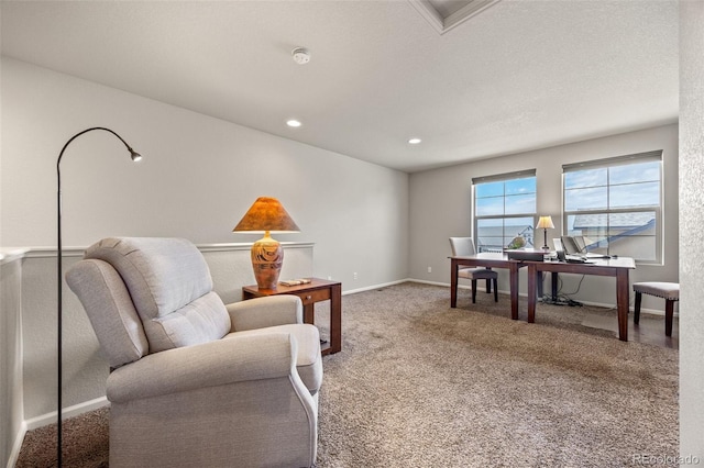 interior space featuring a textured ceiling, recessed lighting, carpet, and baseboards