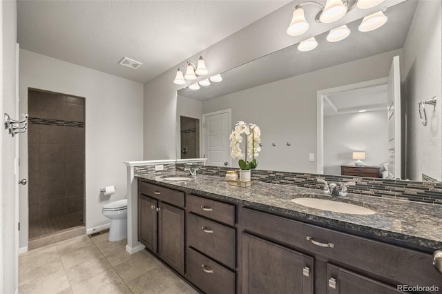 full bath with toilet, a stall shower, a sink, and visible vents