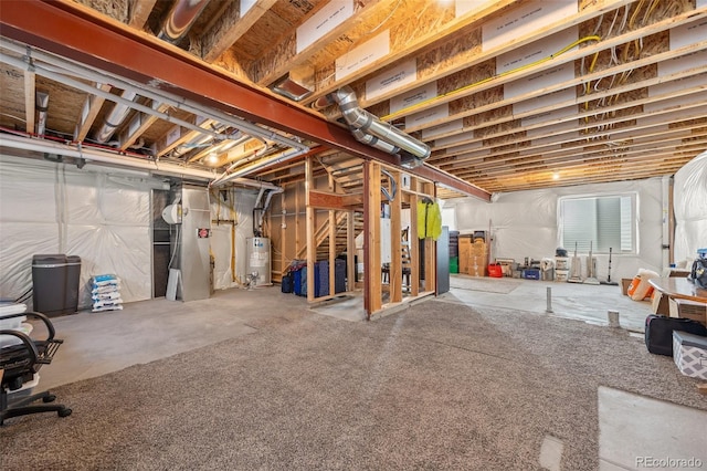 unfinished basement featuring water heater