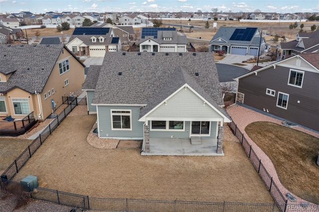 exterior space with a patio, a fenced backyard, and a residential view