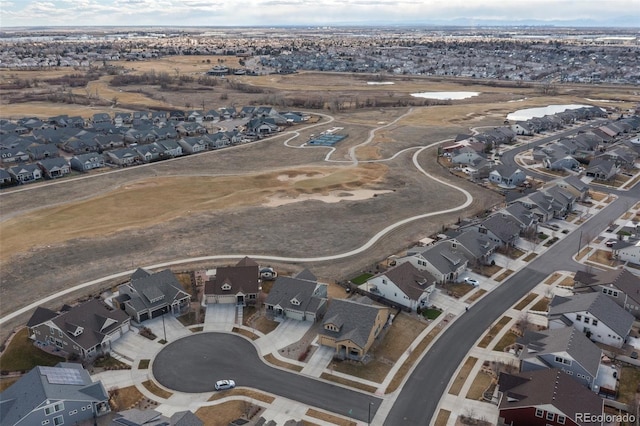 birds eye view of property with a residential view