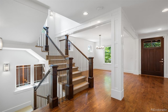 1934 S Sherman St, Denver, CO 80210 - entrance foyer featuring a chandelier, wood finished floors, stairway, and recessed lighting