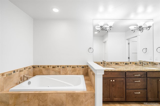 1934 S Sherman St, Denver, CO 80210 - full bath featuring double vanity, a tub with jets, a chandelier, and recessed lighting