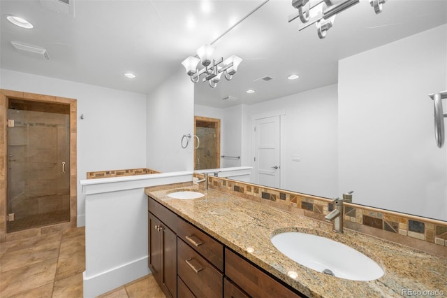 1934 S Sherman St, Denver, CO 80210 - full bathroom featuring a stall shower, double vanity, recessed lighting, a chandelier, and tile patterned flooring