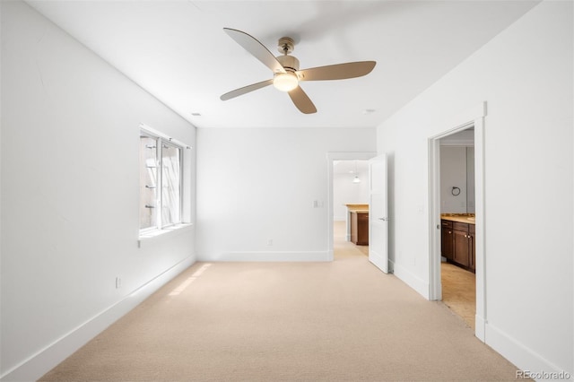 1934 S Sherman St, Denver, CO 80210 - unfurnished bedroom featuring light colored carpet, ensuite bath, and a ceiling fan