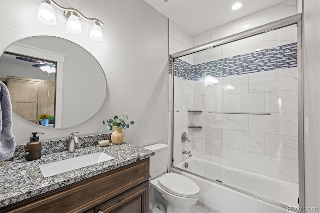 6331 County Road 32, Platteville, CO 80651 - bathroom with toilet, vanity, combined bath / shower with glass door, and ceiling fan