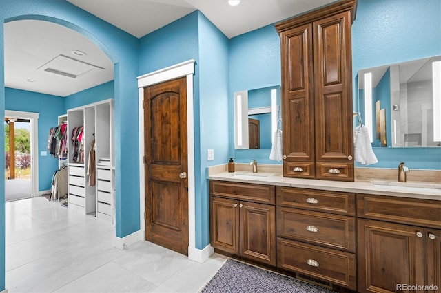 6331 County Road 32, Platteville, CO 80651 - full bath with double vanity, a closet, and baseboards