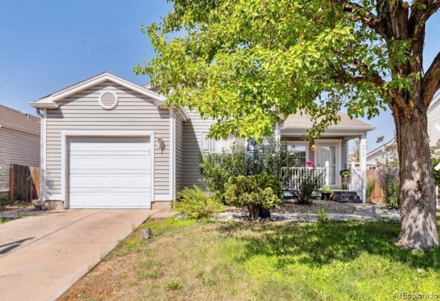 view of front of house with covered porch, a front yard, and a garage